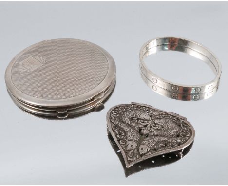 A hallmarked silver ladies compact, with engine turned decoration, together with a Cartier style hinged silver bangle and hal