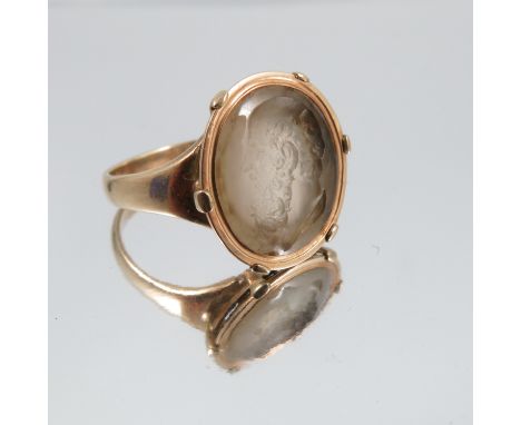 A hardstone intaglio ring, stamped '9ct', carved with the profile of an elderly classical male profile, finger size V, 5.9g g