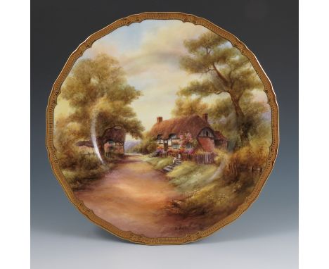 A Royal Worcester plate, fully decorated with a view of Wick with thatched buildings and figures, by Raymond Rushton, circa. 