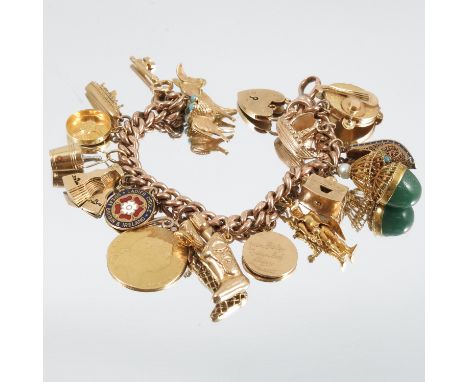 A 9 carat gold bracelet, of solid curb links, with sixteen charms attached including a Spade Guinea, with soldered scroll top
