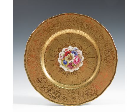 A Royal Worcester cabinet plate, the centre decorated with flowers by Freeman, to a deep acid etched border, diameter 10.75in