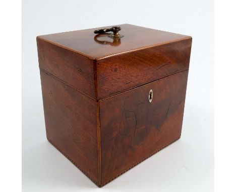 A 19th century mahogany box, with satinwood stringing, gilt metal ring handle to the hinged top, with one side fitted with a 