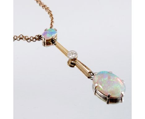 An opal and diamond drop pendant, circa 1920, the oval cabochon measuring approximately 7.1mm long, by 12mm wide and 4.8 mm d
