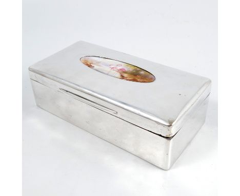 A hallmarked silver rectangular cigarette box, inset with an oval panel of two wading flamingos, probably Royal Worcester, Lo