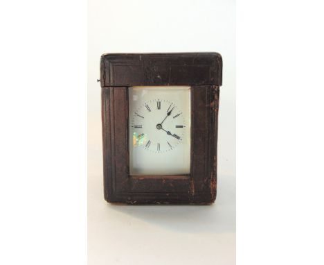 A late 19th century brass carriage clock with enamel dial, the 8 day movement striking on a bell, the back plate stamped B po