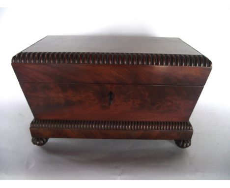 A good quality Regency sarcophagus shaped tea caddy presented in flamed mahogany veneers with vertical banded borders, mushro