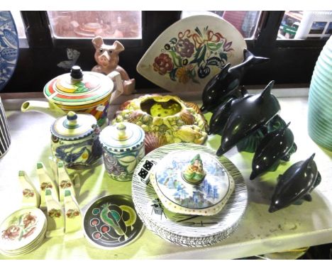 A quantity of ceramics including five Poole Pottery dolphins, two Poole Pottery preserve pots and covers with painted decorat
