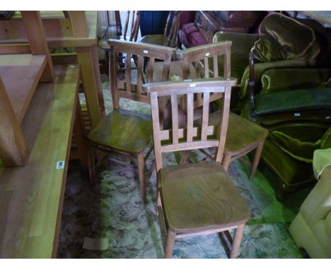 A set of three vintage elm and beechwood chapel chairs complete with hymn book receptacle