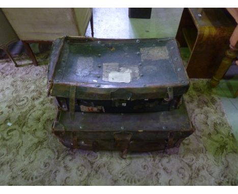 Two vintage reinforced leather suitcases with travelling labels