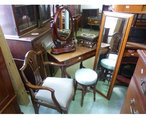 A Victorian mahogany toilet mirror of oval form with scrolled foliate bracket supports, a 19th century mahogany revolving pia