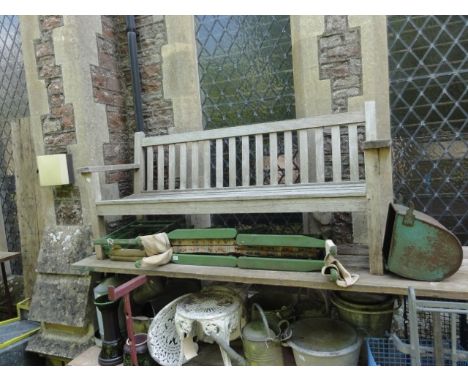A good quality weathered teak three seat garden bench with slatted seat and back, labelled to side rail, Barlow Tyrie