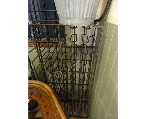 A vintage iron work wine rack to hold 72 bottles