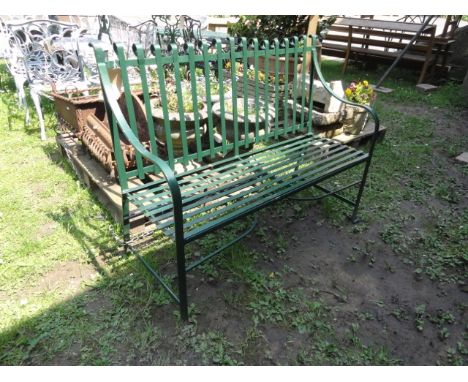 A good quality Regency style two seat cast iron bench with strap work seat and back with scrolled detail 