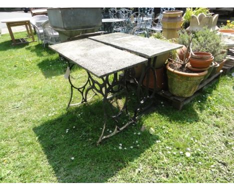 Two garden tables with rectangular marble tops raised on decorative cast iron supports (originally vintage treadle sewing mac