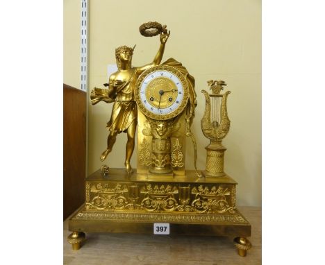 A good quality Empire period gilt brass mantle clock in the classical style, the 8 day striking movement with enamelled chapt