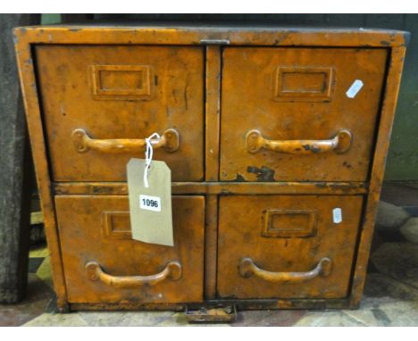 A vintage painted steel nest of four industrial index filing drawers