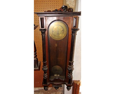 A 19th century walnut Vienna regulator style wall clock with engraved enamel dial and two train weight driven movement, the c