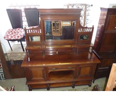 A good quality late Victorian walnut sideboard, the base enclosed by a pair of square moulded panelled doors flanking a centr