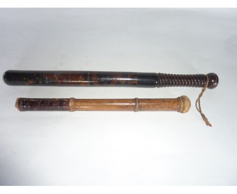 A good quality Victorian turned timber policeman's truncheon, the shaft with all over blackened finish with hand painted and 