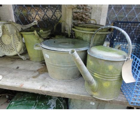 One lot of vintage galvanised ware to include an egg preserving pail complete with lid and loop handle, two galvanised wateri