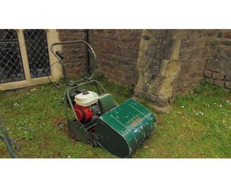 A vintage Atco cylinder petrol lawn mower with Honda engine (possibly replaced)