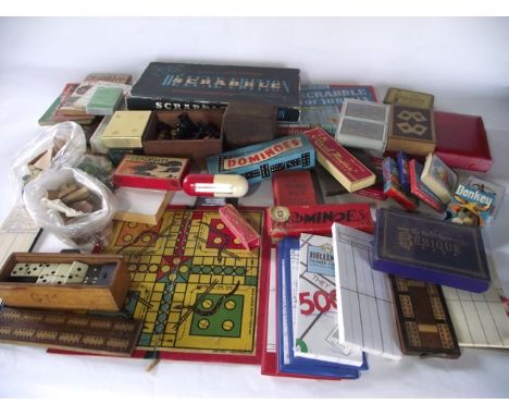 A box containing a quantity of vintage puzzles, games, etc to include a complete turned timber chess set, a game of Scrabble,