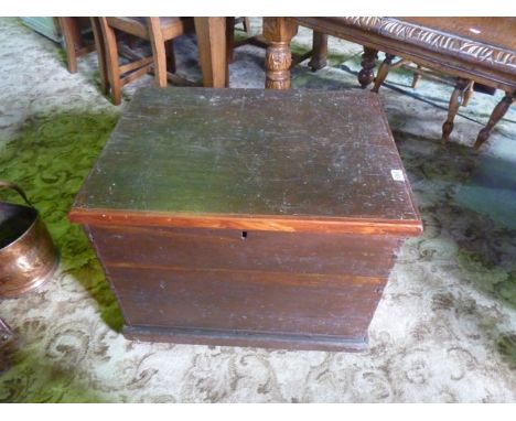 A vintage stained pine box with hinged lid and ironwork carrying handles