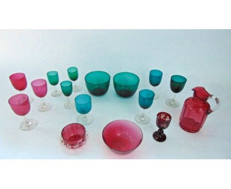 A selection of good quality green glass wares to include a pair of hand blown finger bowls, seven drinking glasses of varying