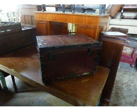 A vintage wooden and steel reinforced chest with hinged lid