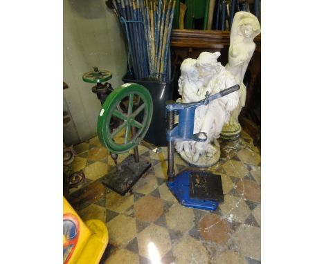 A vintage cast iron hand operated bench top pillar drill together with further Stanley drill press frame