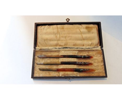 A cased set of three continental writing instruments, pencil, pen and quill cutter with mother-of-pearl inlaid handles