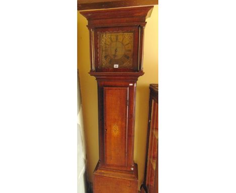 A late 18th century oak longcase clock, the full length door crossbanded in walnut and with an oval marquetry panel set withi