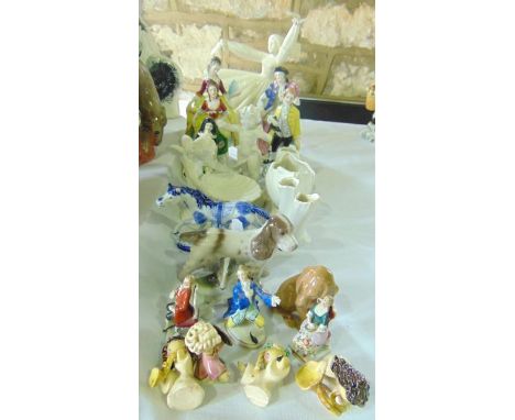 A collection of decorative ceramic figures and animals including a Danish B & G model of a doleful seated dachshund a further