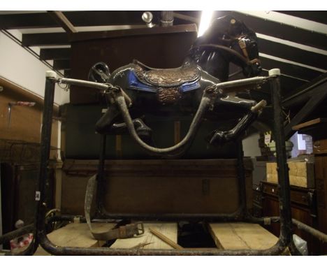 A vintage celluloid Mobo style childs toy rocking horse with tubular steel and sprung framework