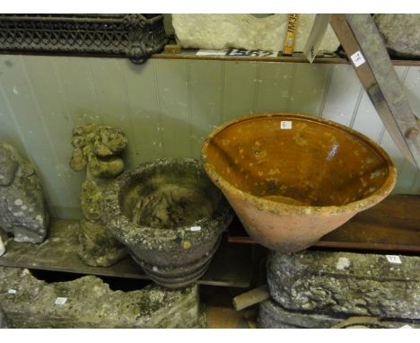 A weathered cast composition stone garden planter of circular tapered form, a further weathered bird bath support in the form