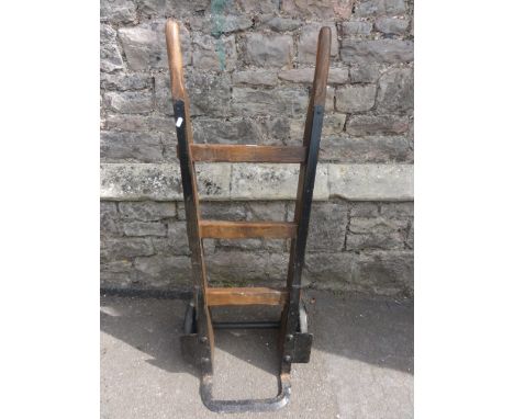A vintage sack truck with ashwood shafts and iron fittings