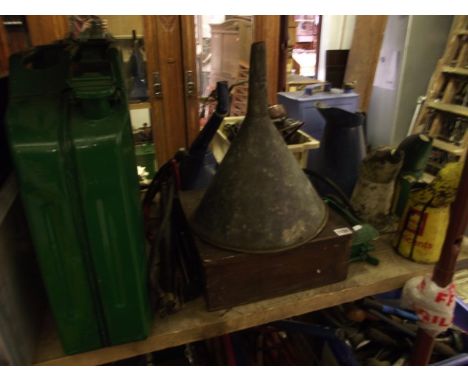 A small collection of motoring related items to include a selection of vintage oil jugs of varying size including three Shell