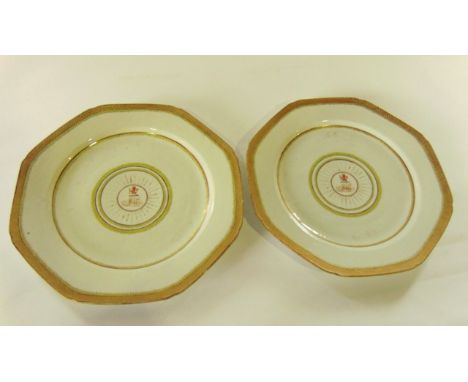 A pair of early 19th century Chinese plates with painted and gilded armorial crests of a lion holding an arrow, with initials