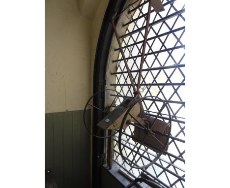 A vintage seed drill with ironwork frame and spoke wheels, together with two further vintage cylinder push lawn mowers and a 