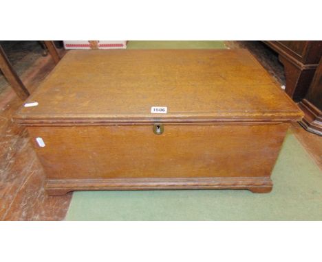A 19th century pine box on bracket supports with rising lid and original simulated oak grain finish, 58 cm length