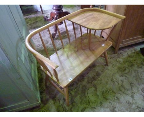 An Ercol style elm and beechwood stick back telephone seat with simple moulded rail and corner shelf, labelled Chippy Heath F