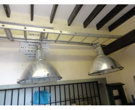 A pair of contemporary Musco industrial hanging ceiling light with domed shades 
