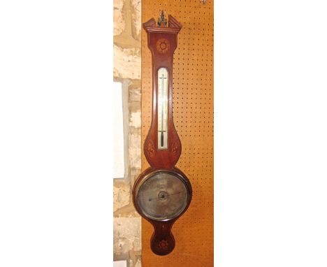 A Georgian mahogany wheel barometer, the casework with conch shell, floral and other marquetery detail set within box wood an