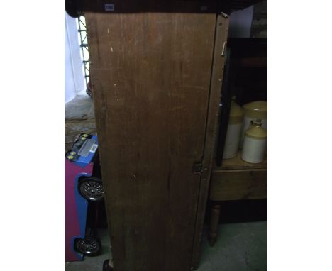 A large vintage stripped pine box ottoman with hinged lid and exposed dovetail construction raised on turned bun supports (or