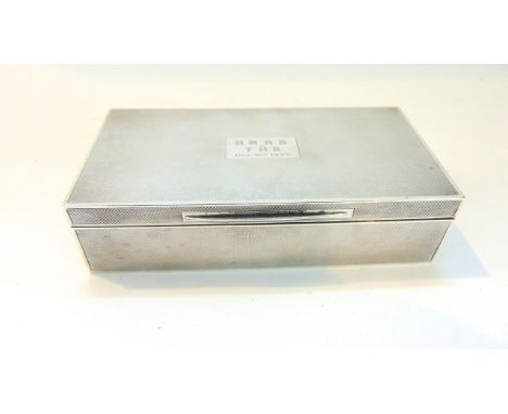 A George V silver cigarette box, D. Bros, Birmingham, 1930, the rectangular body with engine-turned decoration, the cartouche