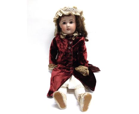 A LARGE SOCIETE FRANCAISE DE FABRICATION DE BEBES ET JOUETS BISQUE SOCKET HEAD DOLL  with a long brown wig, sleeping blue gla