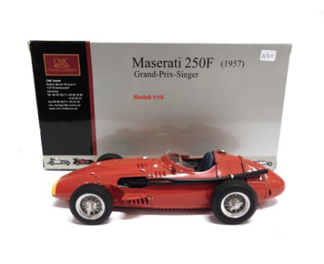 A 1/18 SCALE CMC NO.M051, MASERATI 250F, 1957  red, mint or near mint, boxed.
