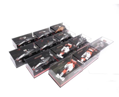 TWELVE 1/43 SCALE MINICHAMPS MCLAREN FORMULA 1 RACING CARS  each mint or near mint and boxed.
