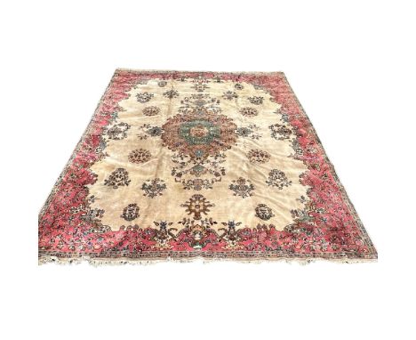 An Isparta carpet, South West Anatolia, circa 1930's, the ivory field with a large central polychrome medallion, 495 x 365cm.