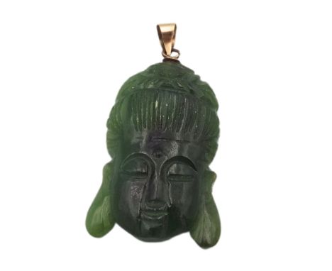 A Chinese jade pendant depicting a Buddha, with 14k stamped bail, 3.5 x 2cm.&nbsp;